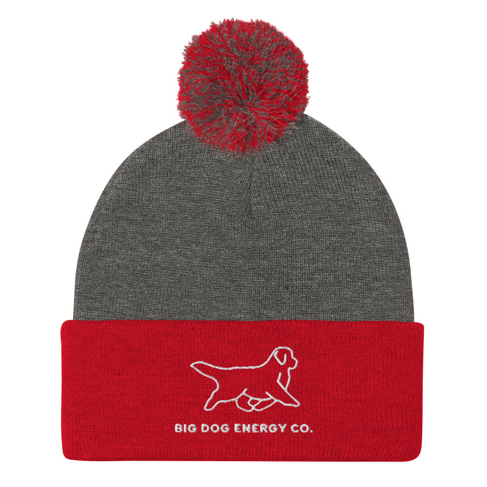 Dark heather grey beanie with heather grey and red pom and red cuff with Big Dog Energy Company logo