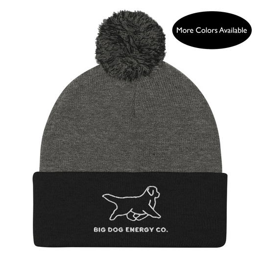 Dark grey winter hat with grey and black pom and black cuff with Big Dog Energy Company logo