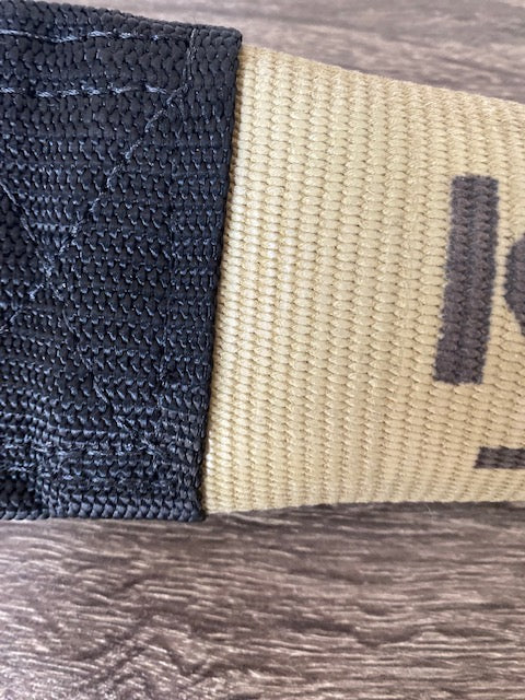 Close up view of yellow 15 inch K-9 Workout training tug toy made from new fire hose by Bulletproof Pet Products for heavy chewers