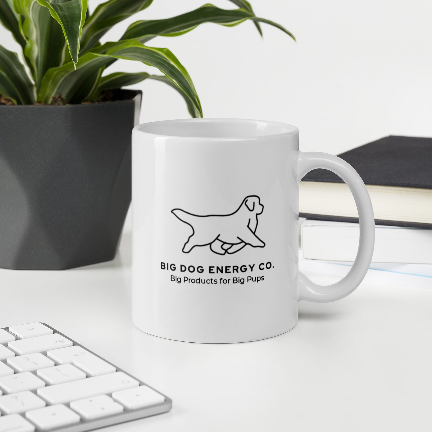 Back side of white 11 oz coffee mug with the Big Dog Energy Company logo and slogan that says "Big Products for Big Pups"