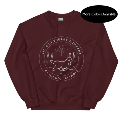 Maroon crew neck sweatshirt with the Big Dog Energy Company summer camp logo, which is white line art of the outline of a Newfoundland dog trotting through grass with primitive trees and a radiant sun in the background. All of this is encased by two concentric circles, with "Big Dog Energy Company, Chicago, Illinois" wrapped around the inside of the circles and surrounding the logo.