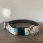 Front view of giant breed dog collar with blue, red, yellow, and green geometric shapes and black plastic buckle.