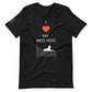 Front of a black t-shirt that reads "I love my bed hog" in white text over an illustration that is the white silhouette of a large dog laying on the gray silhouette of a bed. The word "love" is symbolized by a red heart.