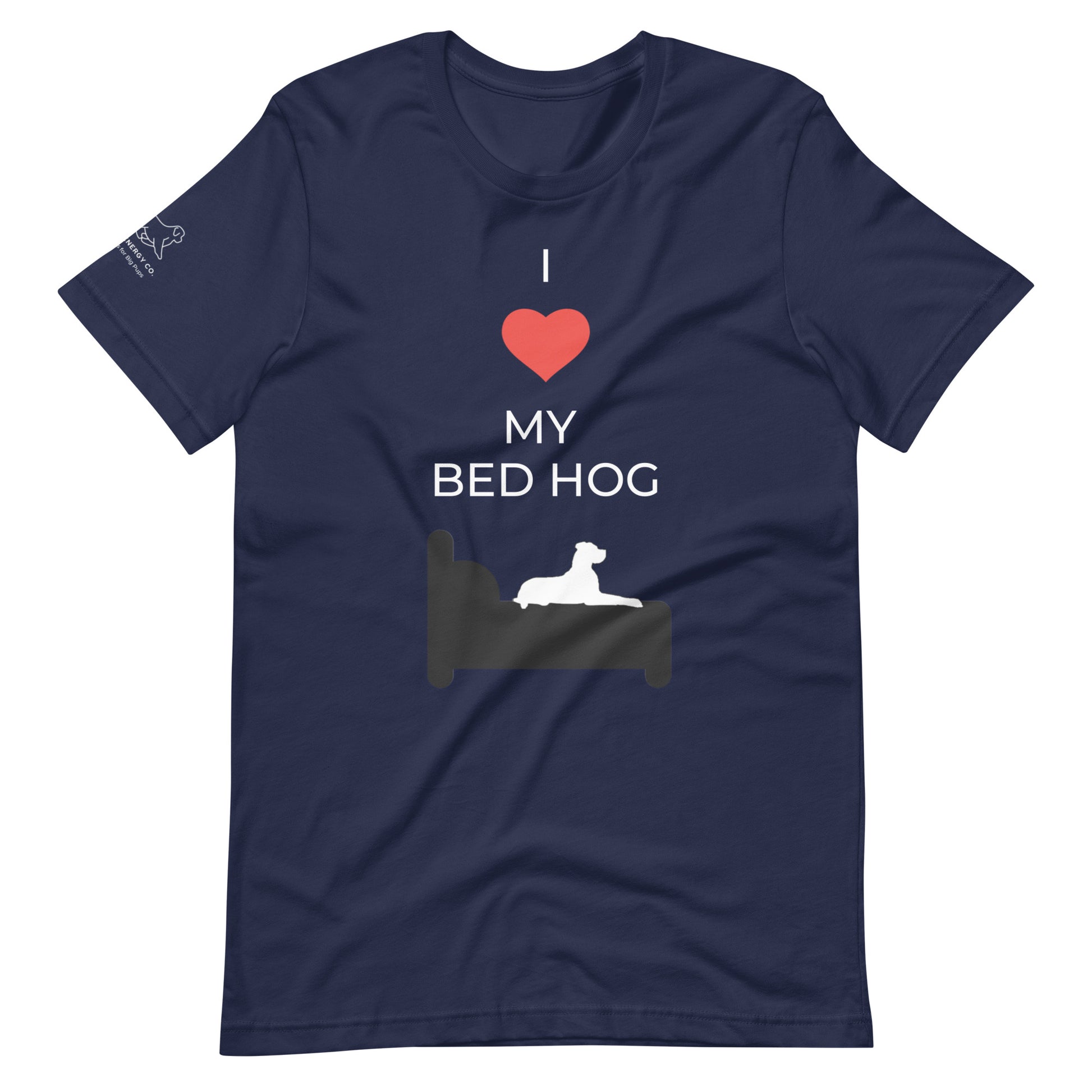 Front of a navy blue t-shirt that reads "I love my bed hog" in white text over an illustration that is the white silhouette of a large dog laying on the deep gray silhouette of a bed. The word "love" is replaced by a red heart symbol.