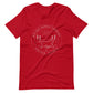 Red t-shirt with the Big Dog Energy Company summer camp logo, which is white line art of the outline of a Newfoundland dog trotting through grass with primitive trees and a radiant sun in the background. All of this is encased by two concentric circles, with "Big Dog Energy Company, Chicago, Illinois" wrapped around the inside of the circles and surrounding the logo.