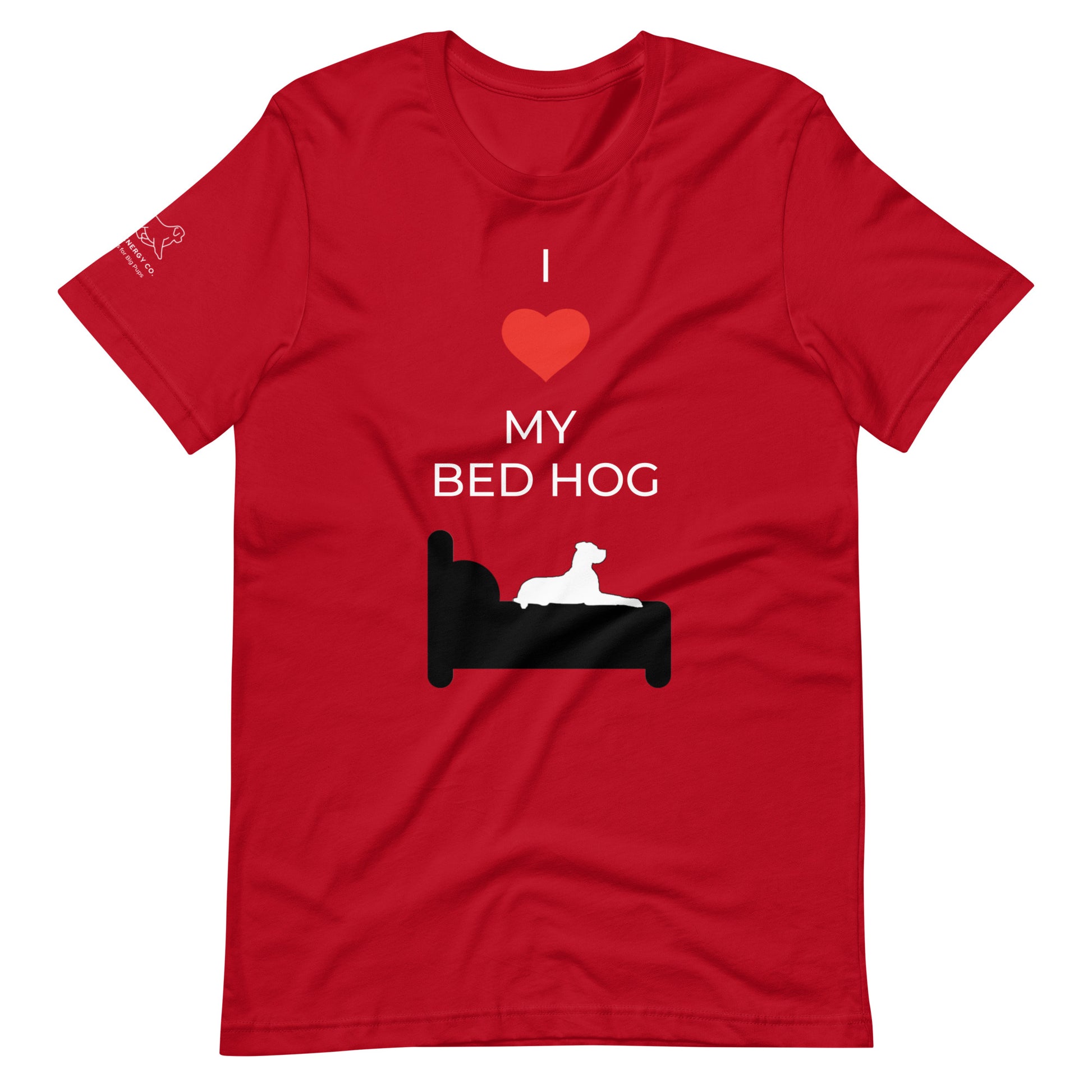 Front of a red t-shirt that reads "I love my bed hog" in white text over an illustration that is the white silhouette of a large dog laying on the black silhouette of a bed. The word "love" is replaced by a brighter red heart symbol.