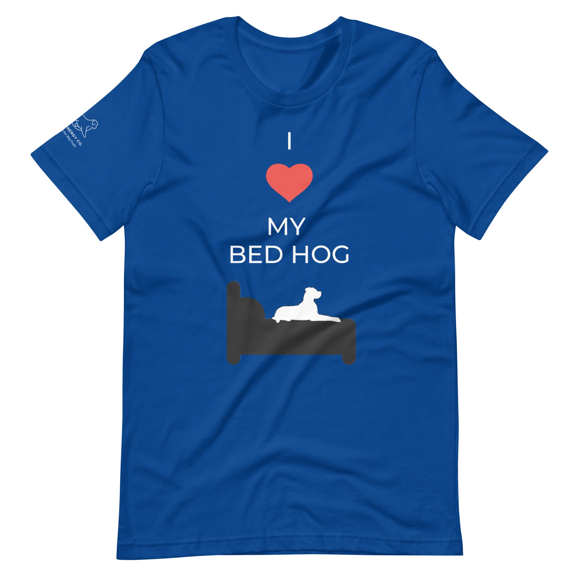 Front of a true royal blue t-shirt that reads "I love my bed hog" in white text over an illustration that is the white silhouette of a large dog laying on the dark silhouette of a bed. The word "love" is replaced by a red heart symbol.