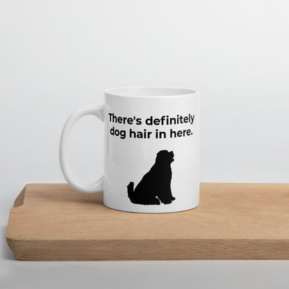 White 11 oz coffee mug with a "There's definitely dog hair in here" slogan and the silhouette of a big Newfoundland dog looking up