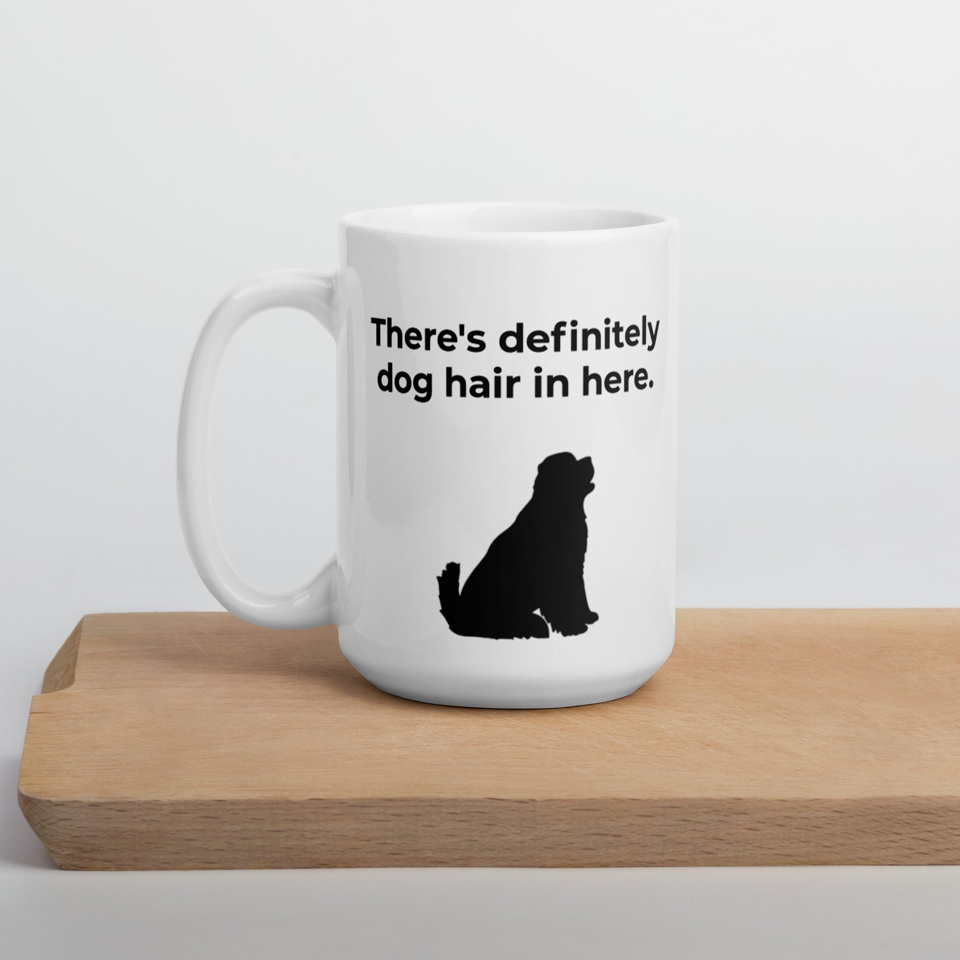 White 15 oz coffee mug with a "There's definitely dog hair in here" slogan and the silhouette of a big Newfoundland dog looking up